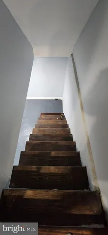 a white toilet sitting next to a bathroom sink