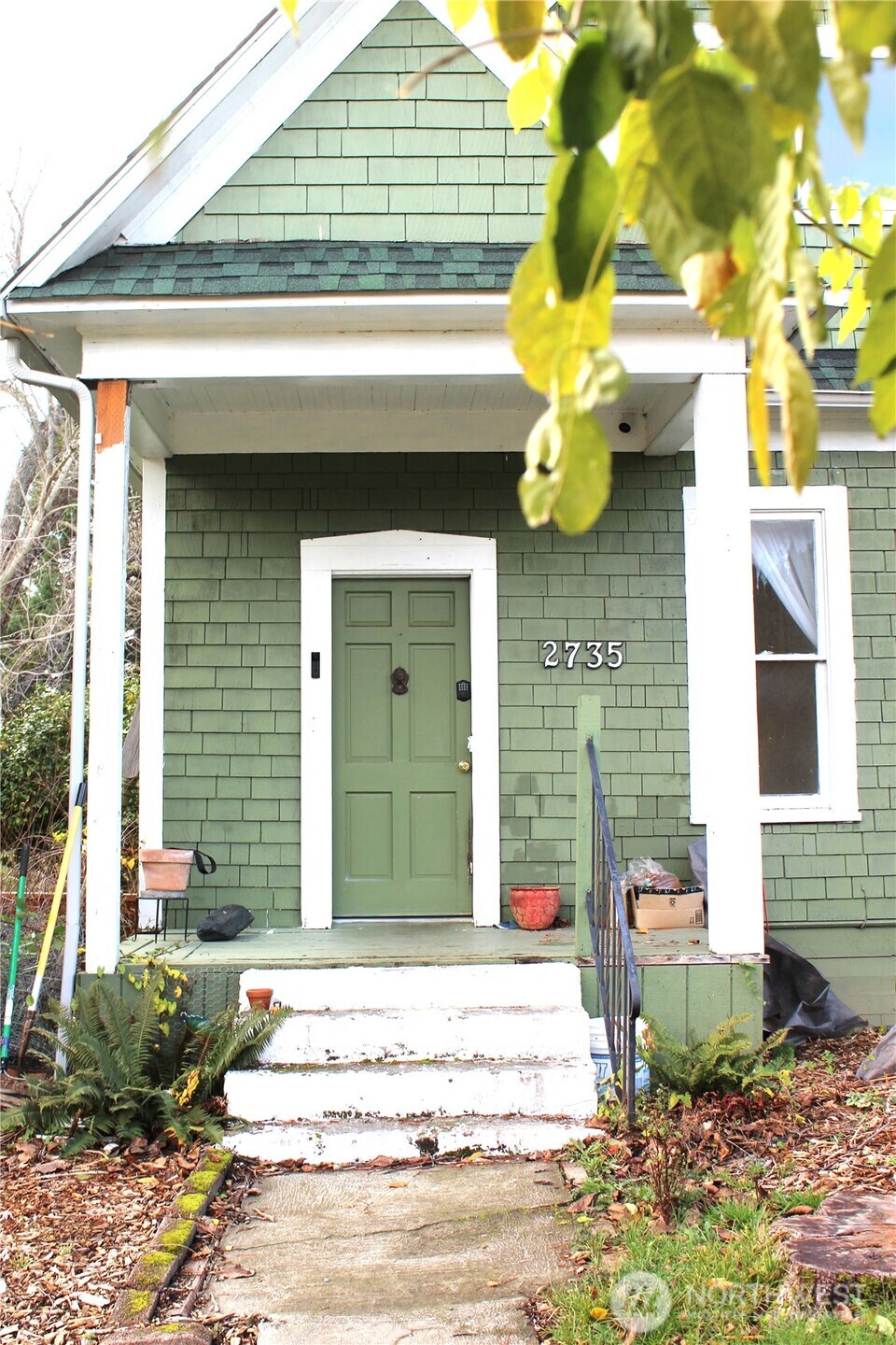 a front view of a house with fountain