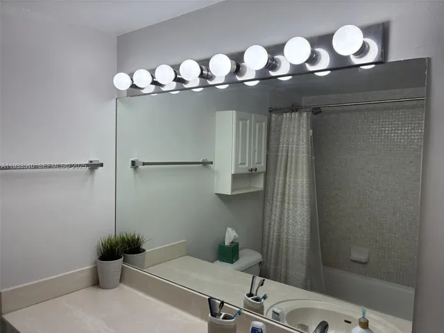 a view of a swimming pool with an outdoor seating