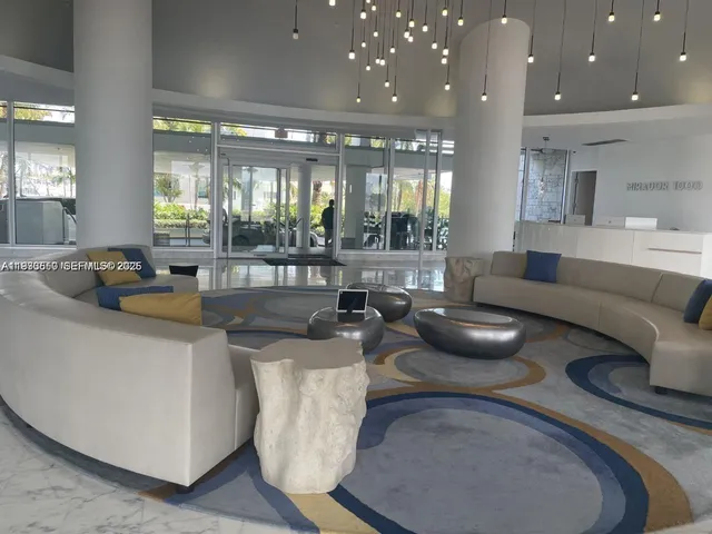 a living room with furniture and a mirror