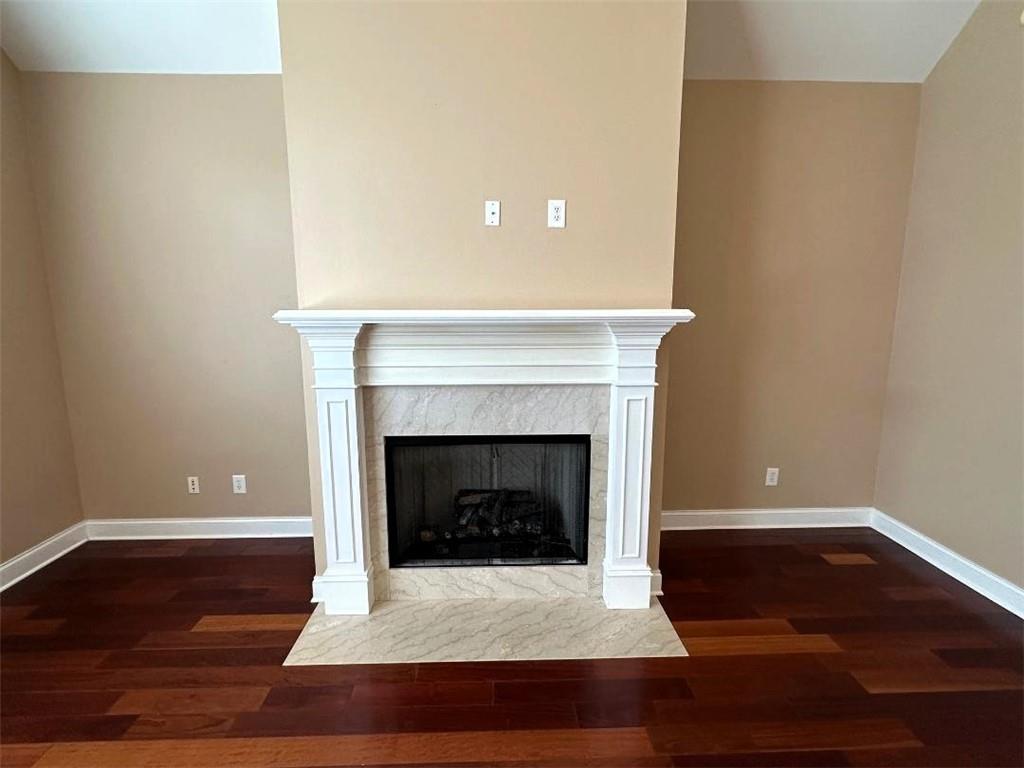107 Savoy Place Calhoun, GA 30701 - Photo 11 of 32 a living room with a fireplace and a fireplace