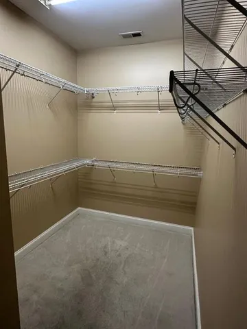 a view of a room with racks on the wall