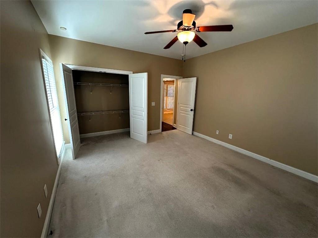 107 Savoy Place Calhoun, GA 30701 - Photo 20 of 32 an empty room with closet and fan
