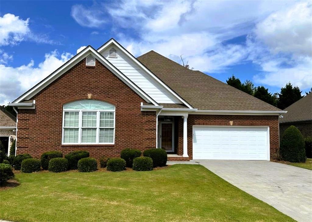 107 Savoy Place Calhoun, GA 30701 - Photo 2 of 32 a front view of a house with a yard
