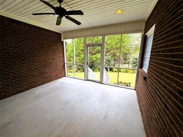 a view of a room with a large window
