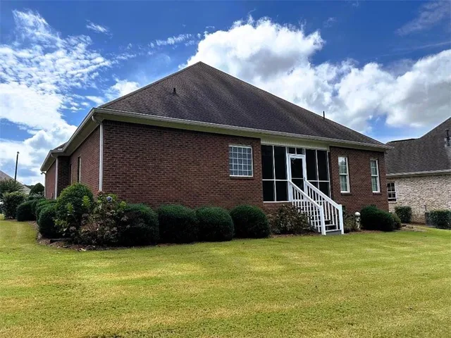 a house with garden in front of it