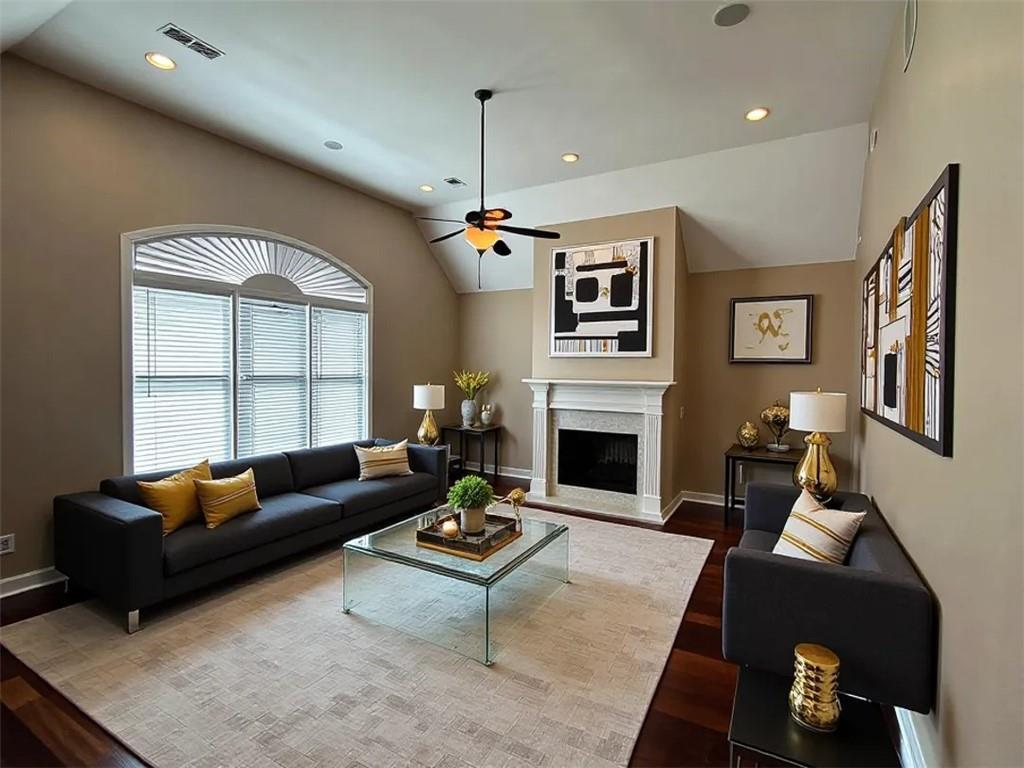 107 Savoy Place Calhoun, GA 30701 - Photo 3 of 32 a living room with furniture and a fireplace