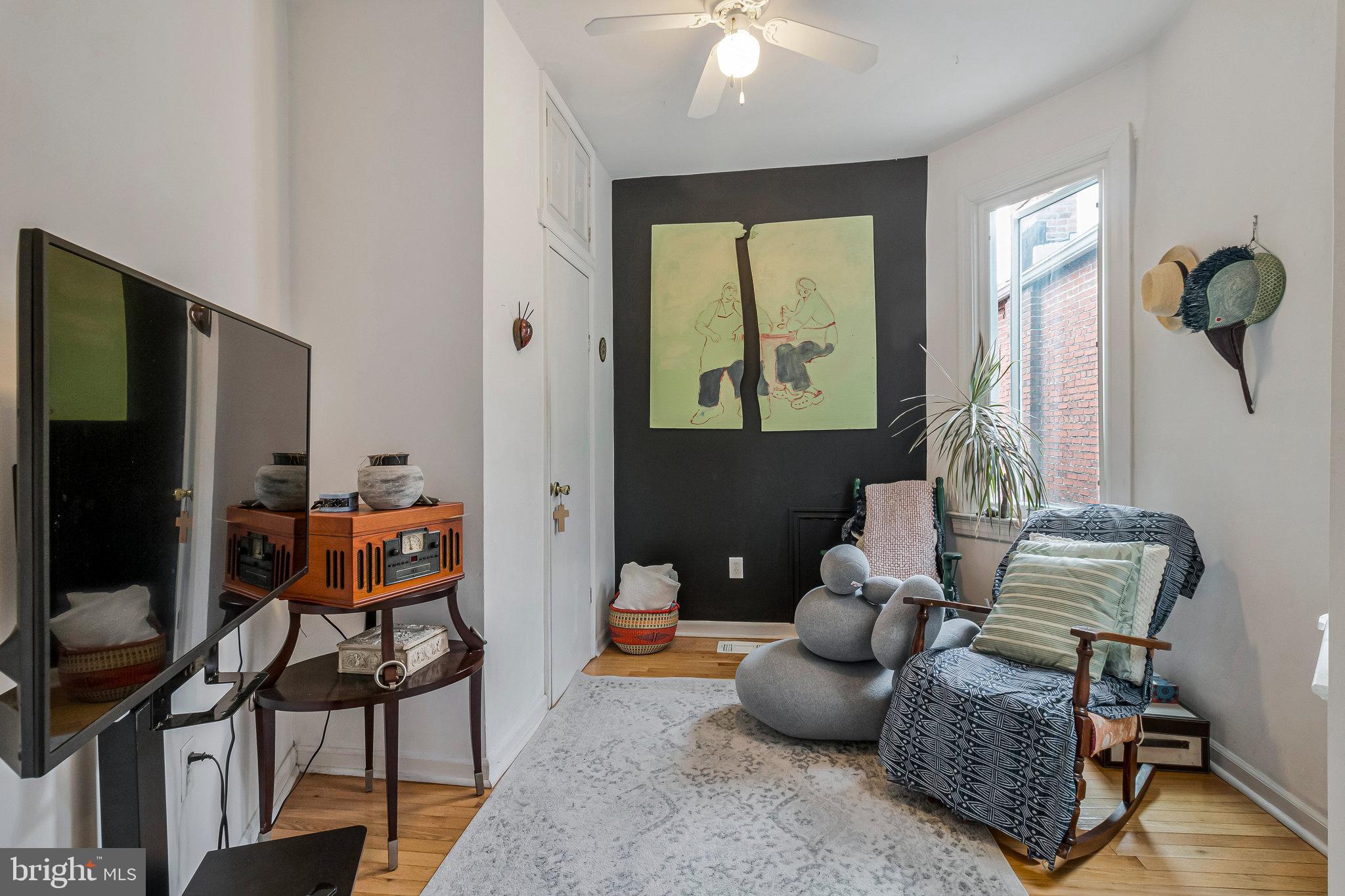 902 Westminster Street Northwest Washington, DC 20001 - Photo 15 of 20 a living room with furniture and a flat screen tv
