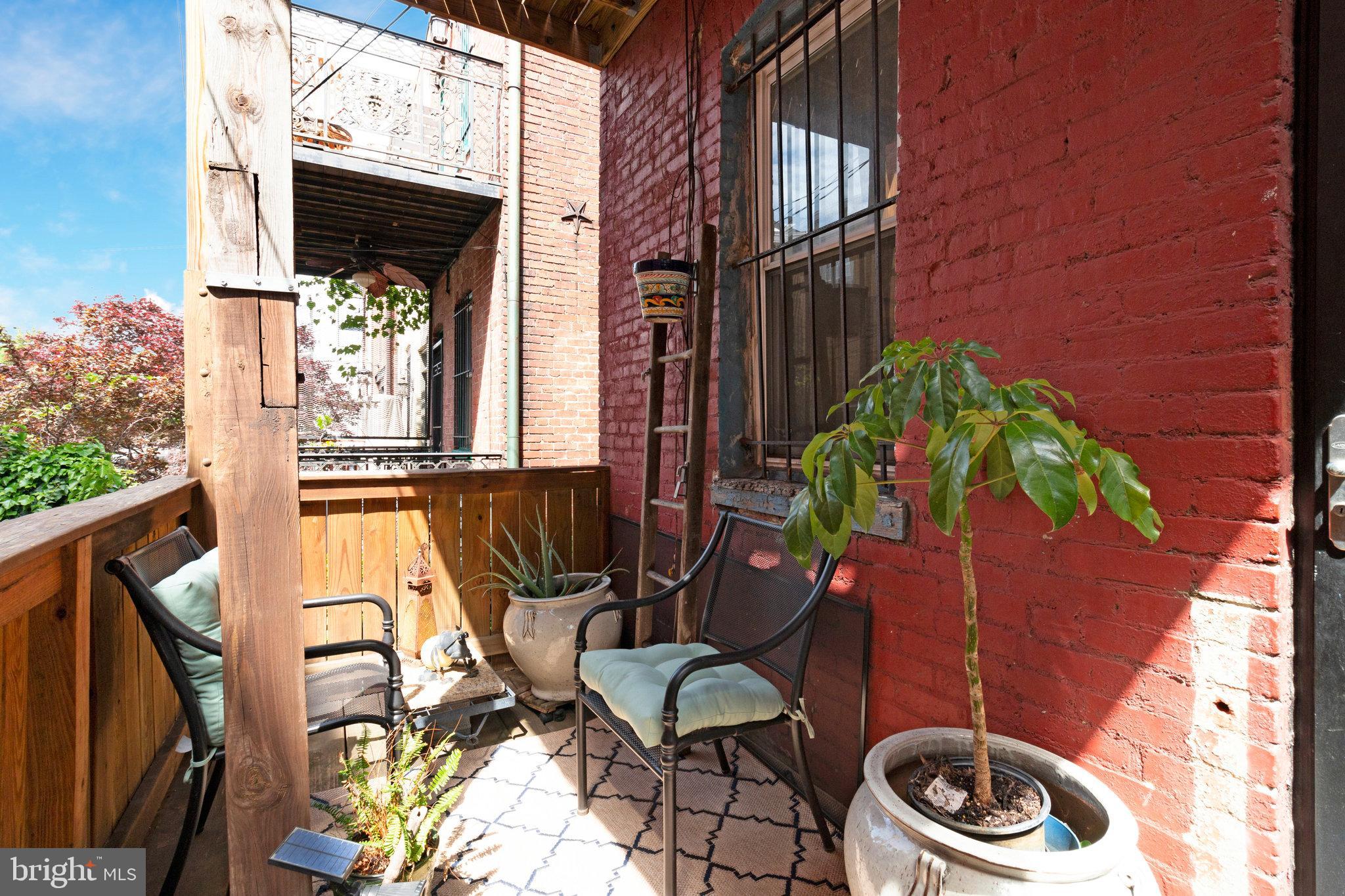 902 Westminster Street Northwest Washington, DC 20001 - Photo 19 of 20 a couple of chairs sitting in front of a door