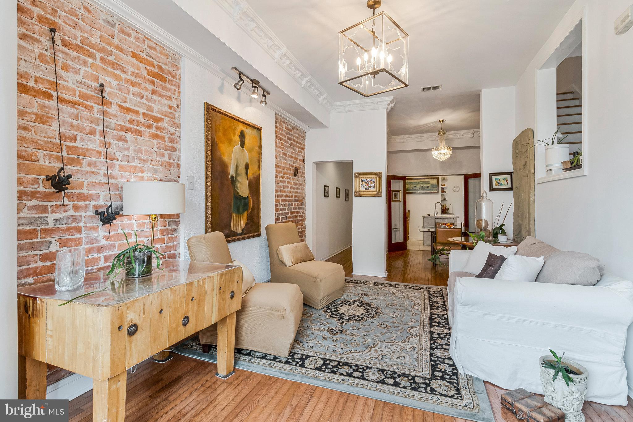 902 Westminster Street Northwest Washington, DC 20001 - Photo 3 of 20 a living room with furniture wooden floor and a chandelier