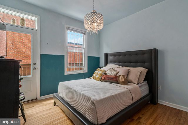 a bedroom with bed and window