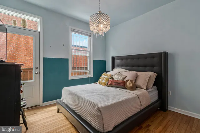 a bedroom with bed and window