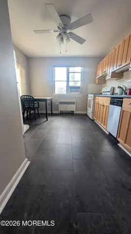 a view of kitchen with furniture and window