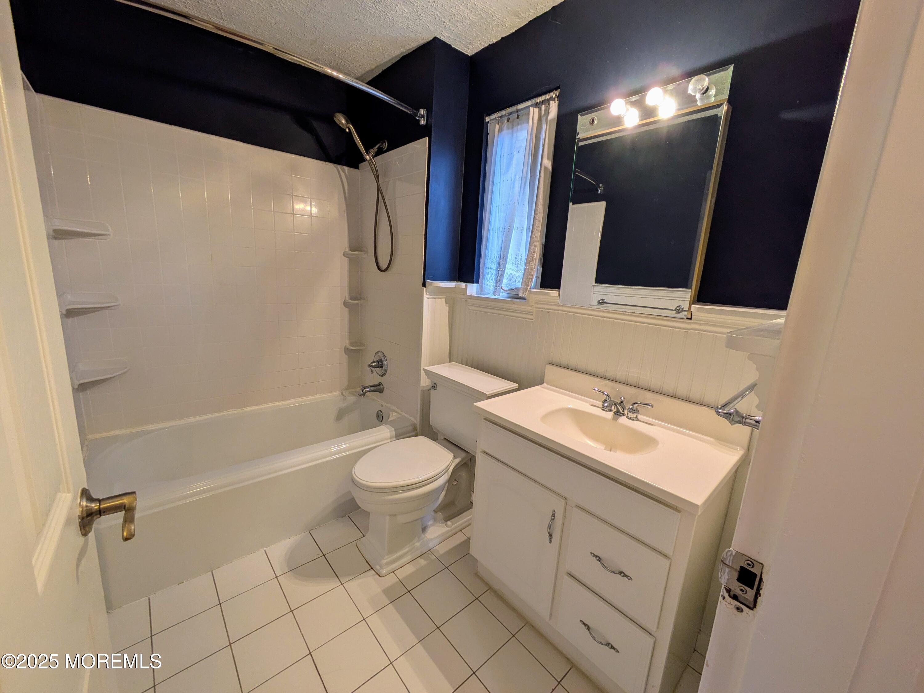 142 South Street, Unit 9A Red Bank, NJ 07701 - Photo 8 of 10 a bathroom with a sink toilet and shower