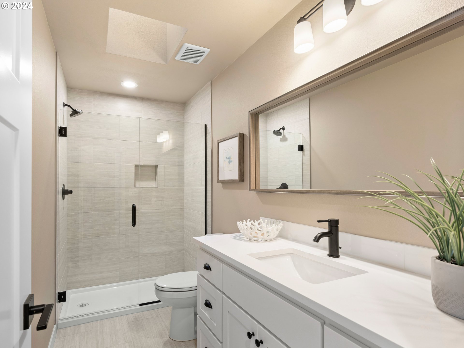 4435 Southeast Umatilla Street Portland, OR 97206 - Photo 25 of 48 a bathroom with a sink a toilet and shower