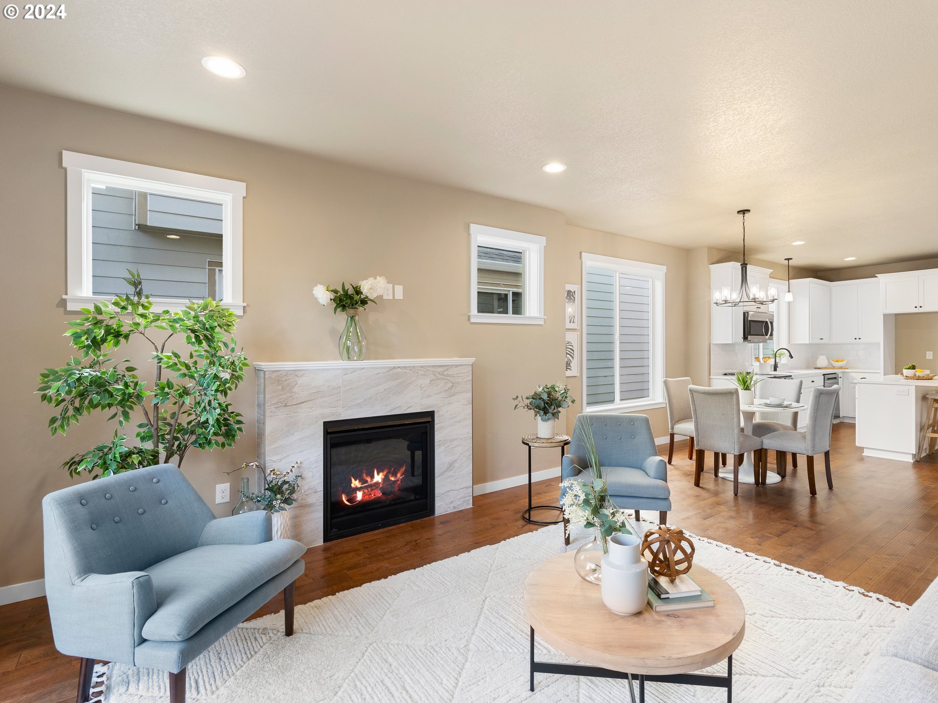 4435 Southeast Umatilla Street Portland, OR 97206 - Photo 4 of 48 a living room with furniture a fireplace and a table