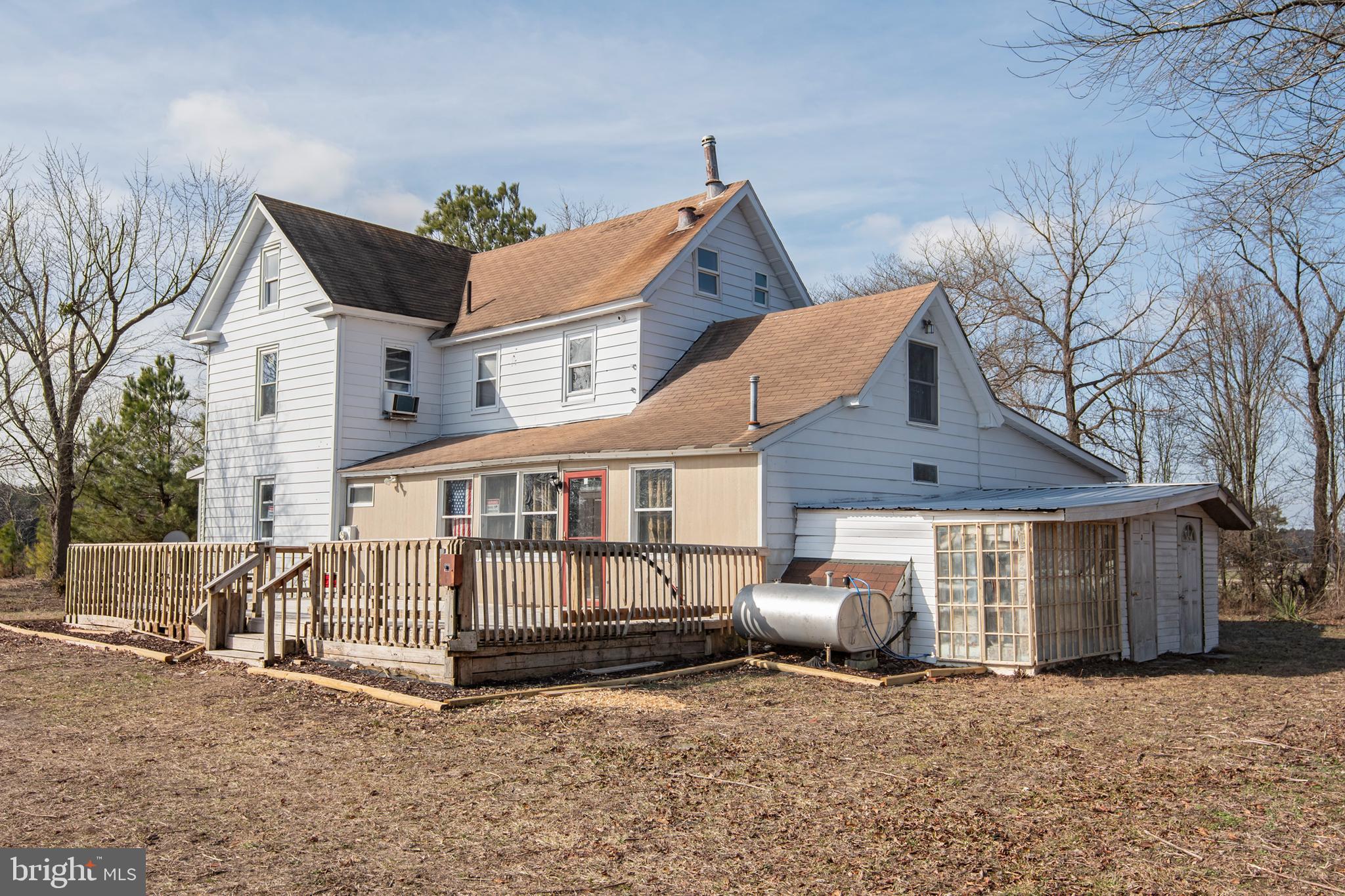 5880 Wheatley Church Road Rhodesdale, MD 21659 - Photo 1 of 27 a view of house with a yard and patio