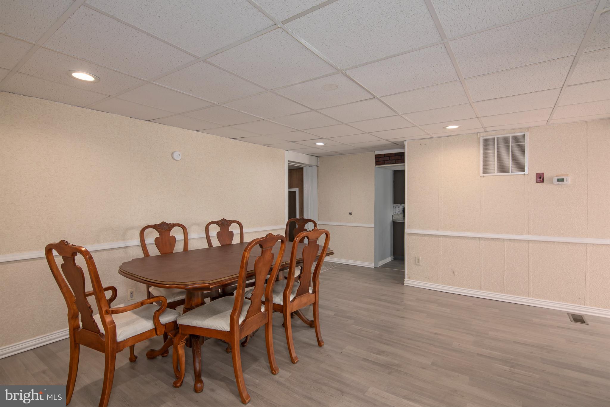 5880 Wheatley Church Road Rhodesdale, MD 21659 - Photo 11 of 27 a dining room with furniture and wooden floor