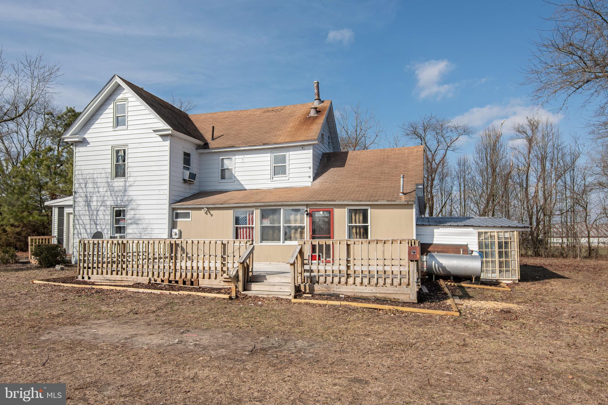 5880 Wheatley Church Road Rhodesdale, MD 21659 - Photo 2 of 27 a view of a house with a small yard and wooden fence