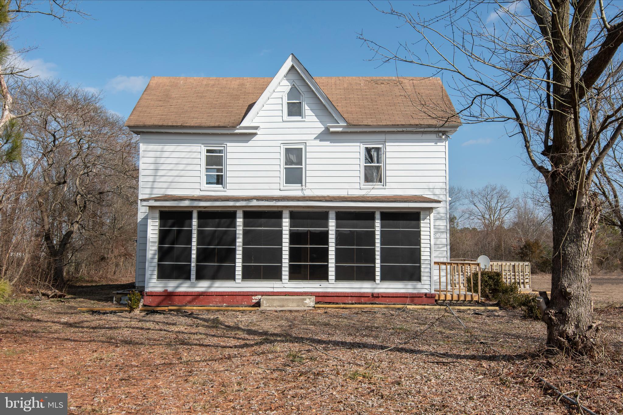 5880 Wheatley Church Road Rhodesdale, MD 21659 - Photo 6 of 27 a view of a house with a large window and a large tree