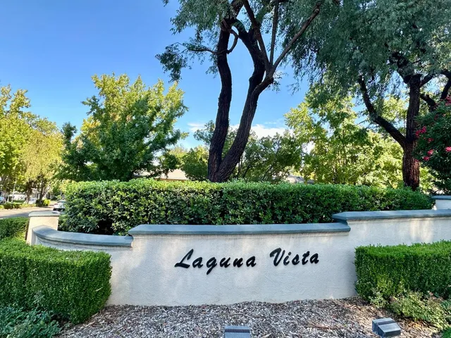a view of outdoor space with signage and flags