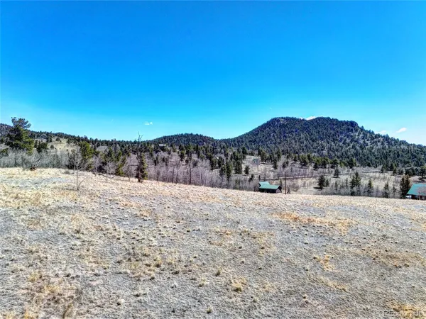 a view of mountain view with a snow in the background