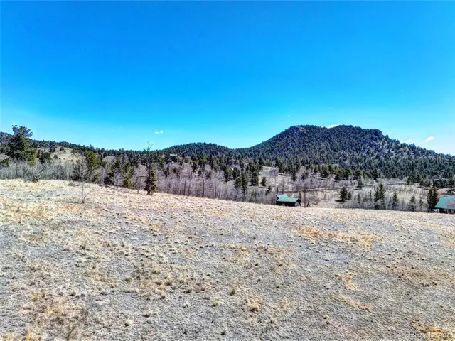 a view of mountain view with a snow in the background