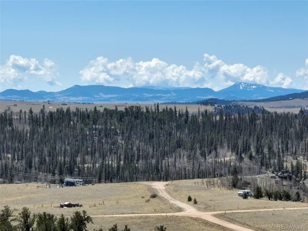 a view of a backyard of a house