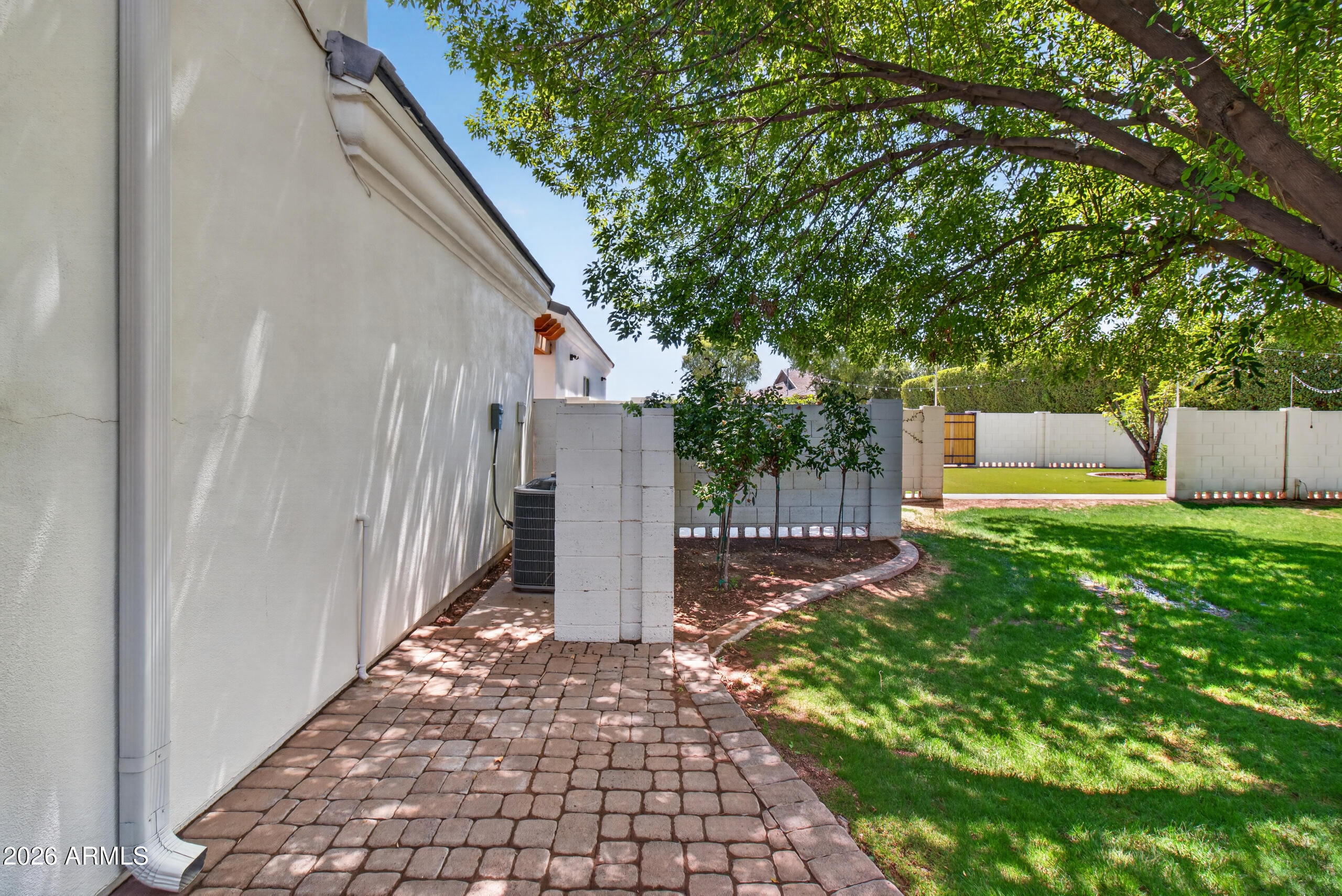 2677 East Queen Creek Road Gilbert, AZ 85297 - Photo 96 of 128 a backyard of a house with lots of green space
