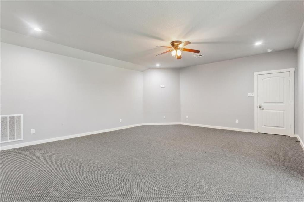 259 County Road 149 Riesel, TX 76682 - Photo 27 of 40 Spare room with ceiling fan, dark carpet, recessed lighting, and baseboards