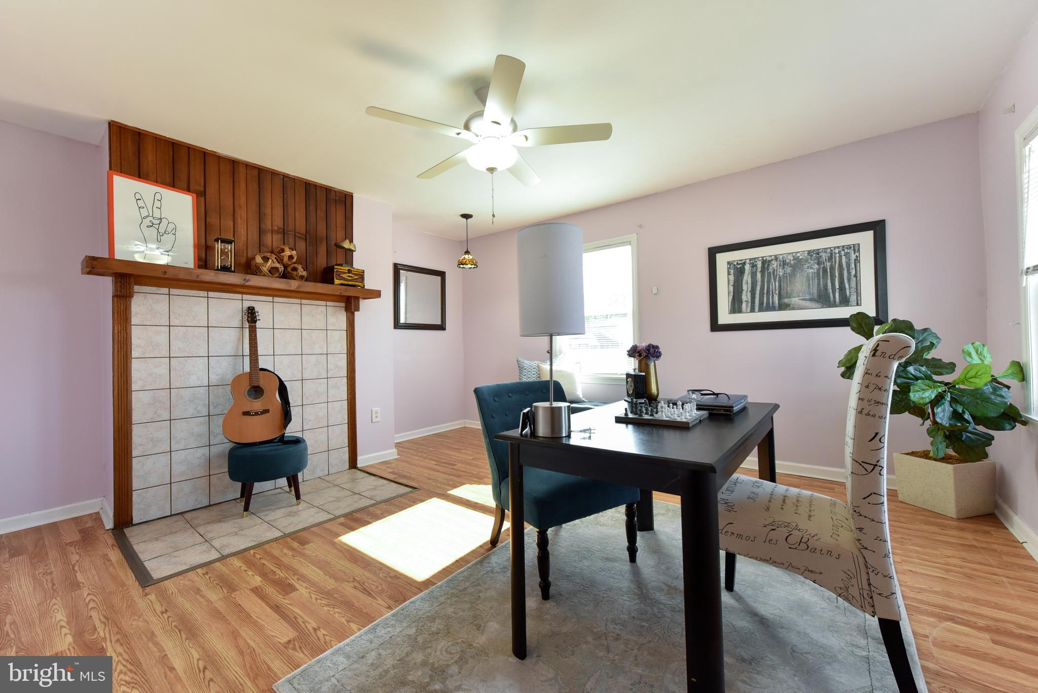 19 Harrisonville Lake Road Pilesgrove, NJ 08098 - Photo 13 of 44 a living room with furniture a chandelier and a window