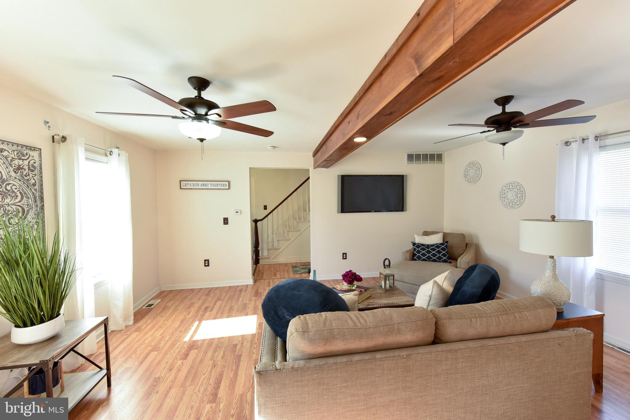 19 Harrisonville Lake Road Pilesgrove, NJ 08098 - Photo 18 of 44 a living room with furniture and a wooden floor