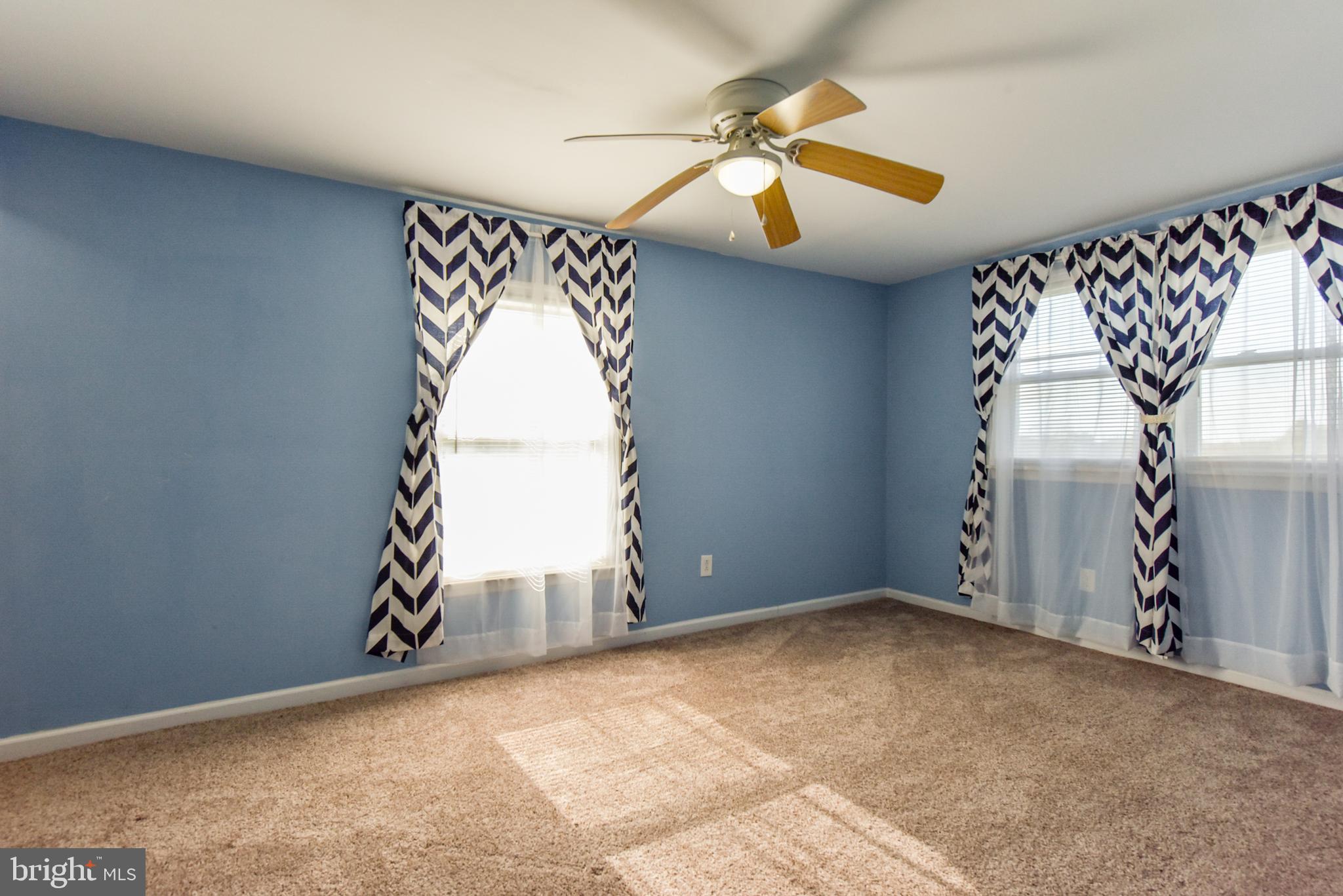 19 Harrisonville Lake Road Pilesgrove, NJ 08098 - Photo 19 of 44 an empty room with windows and fan