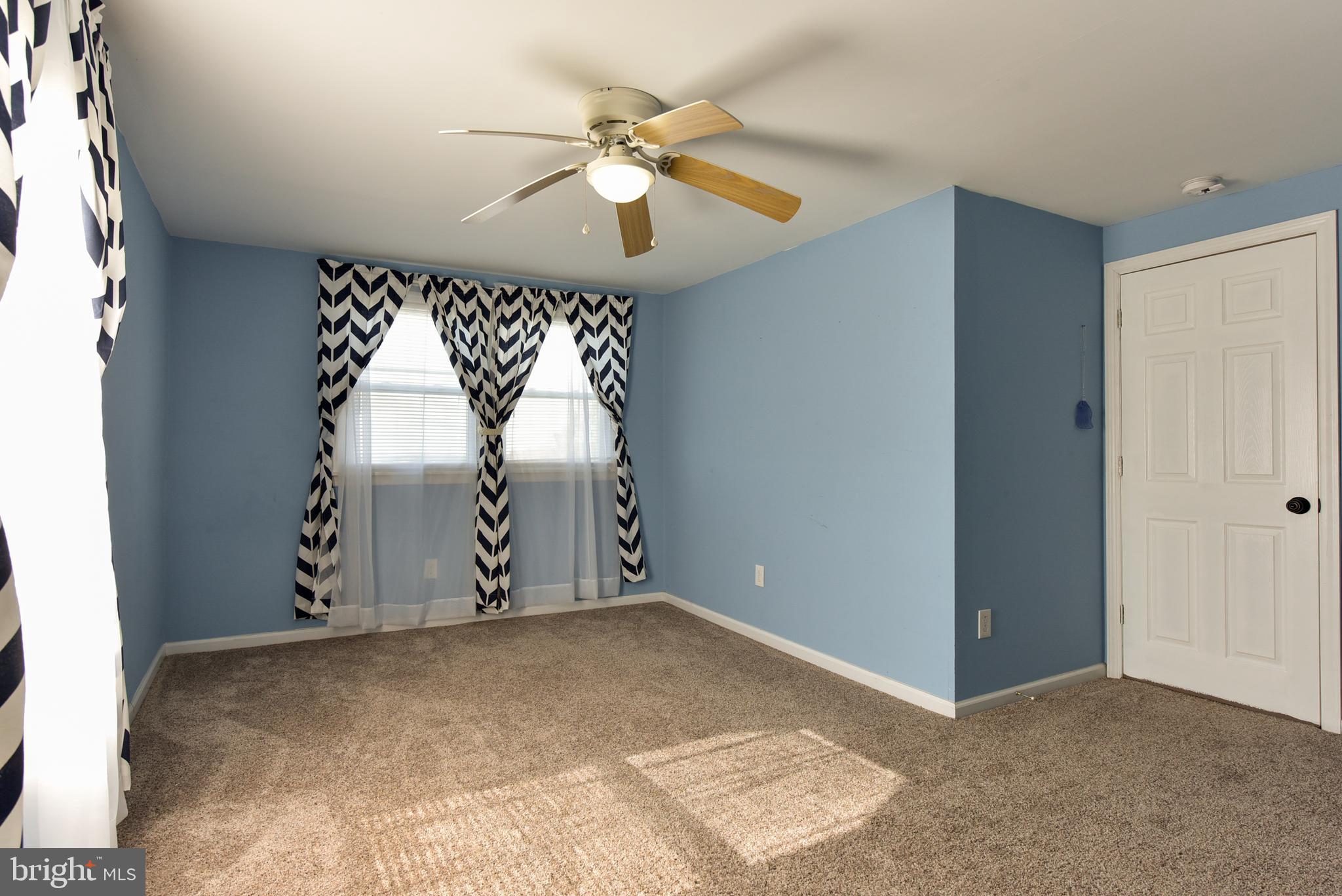 19 Harrisonville Lake Road Pilesgrove, NJ 08098 - Photo 20 of 44 an empty room with windows and fan
