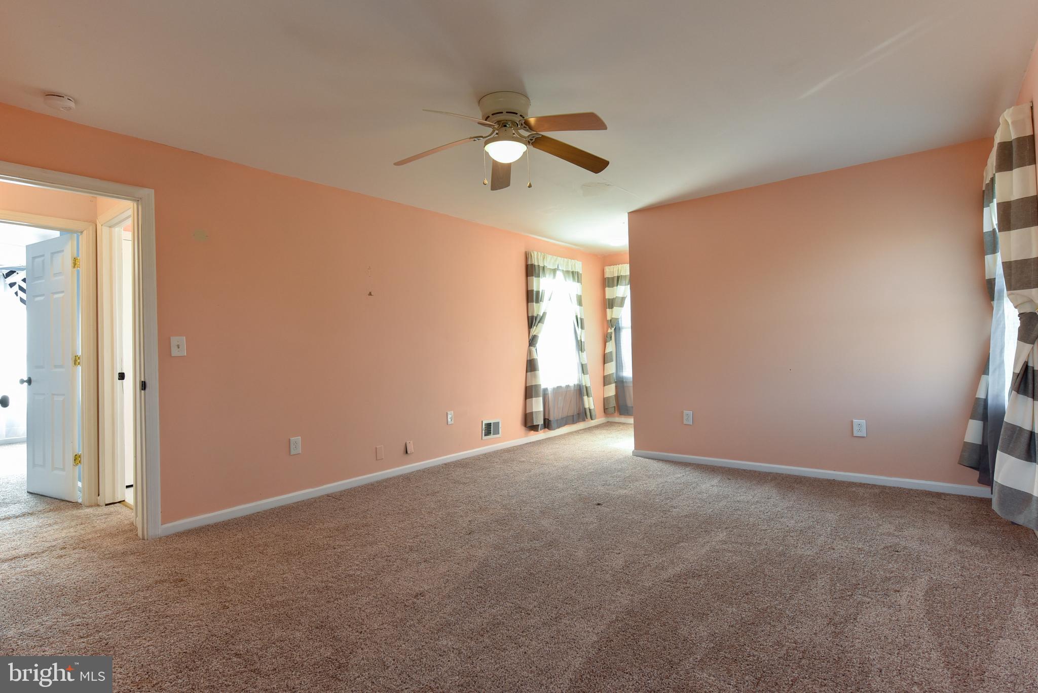 19 Harrisonville Lake Road Pilesgrove, NJ 08098 - Photo 22 of 44 an empty room with ceiling fan and window