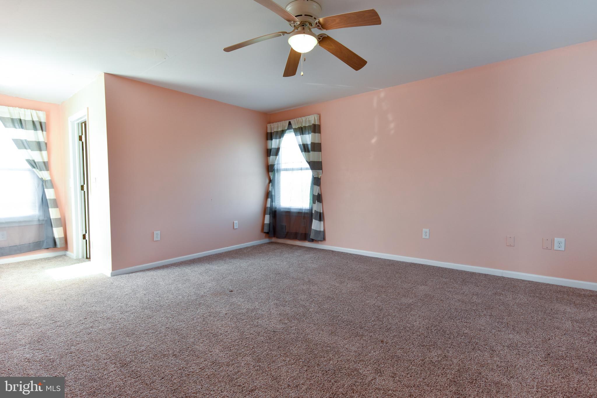 19 Harrisonville Lake Road Pilesgrove, NJ 08098 - Photo 23 of 44 a view of empty room with window and ceiling fan