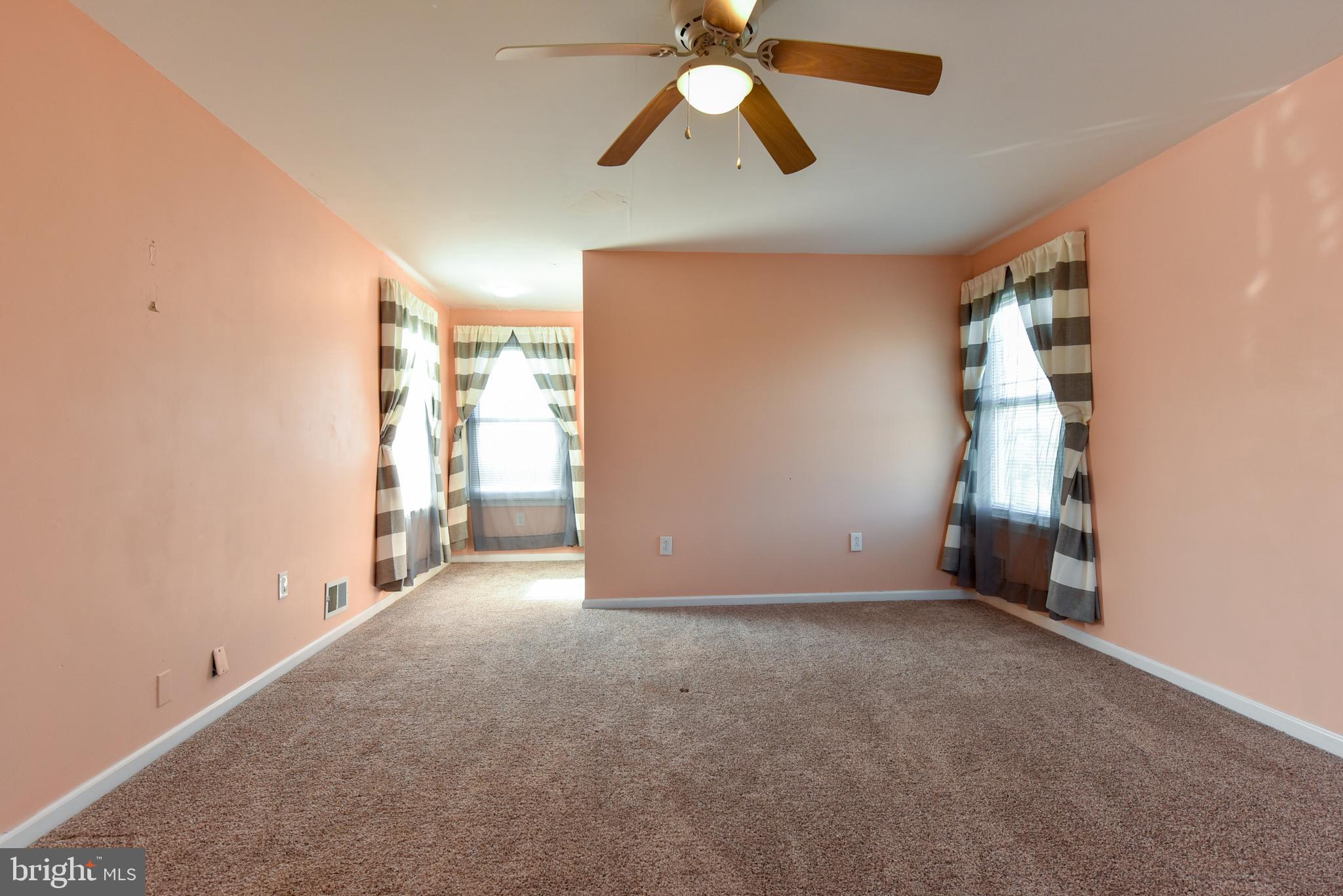 19 Harrisonville Lake Road Pilesgrove, NJ 08098 - Photo 24 of 44 an empty room with chandelier fan and windows