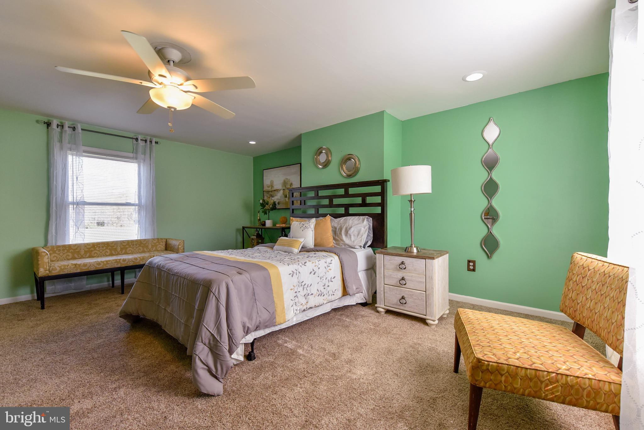 19 Harrisonville Lake Road Pilesgrove, NJ 08098 - Photo 28 of 44 a spacious bedroom with a bed and a chandelier