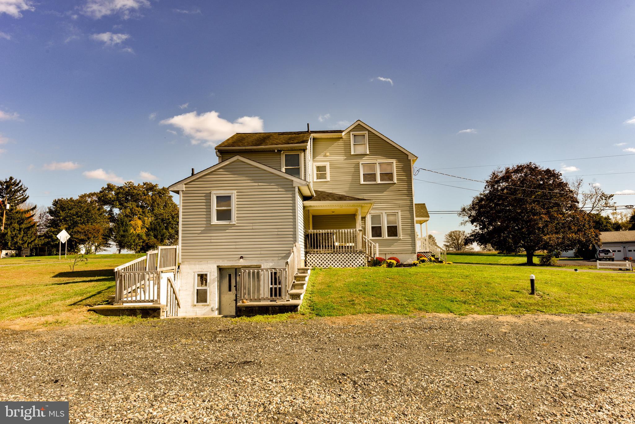 19 Harrisonville Lake Road Pilesgrove, NJ 08098 - Photo 30 of 44 a front view of a house with a yard