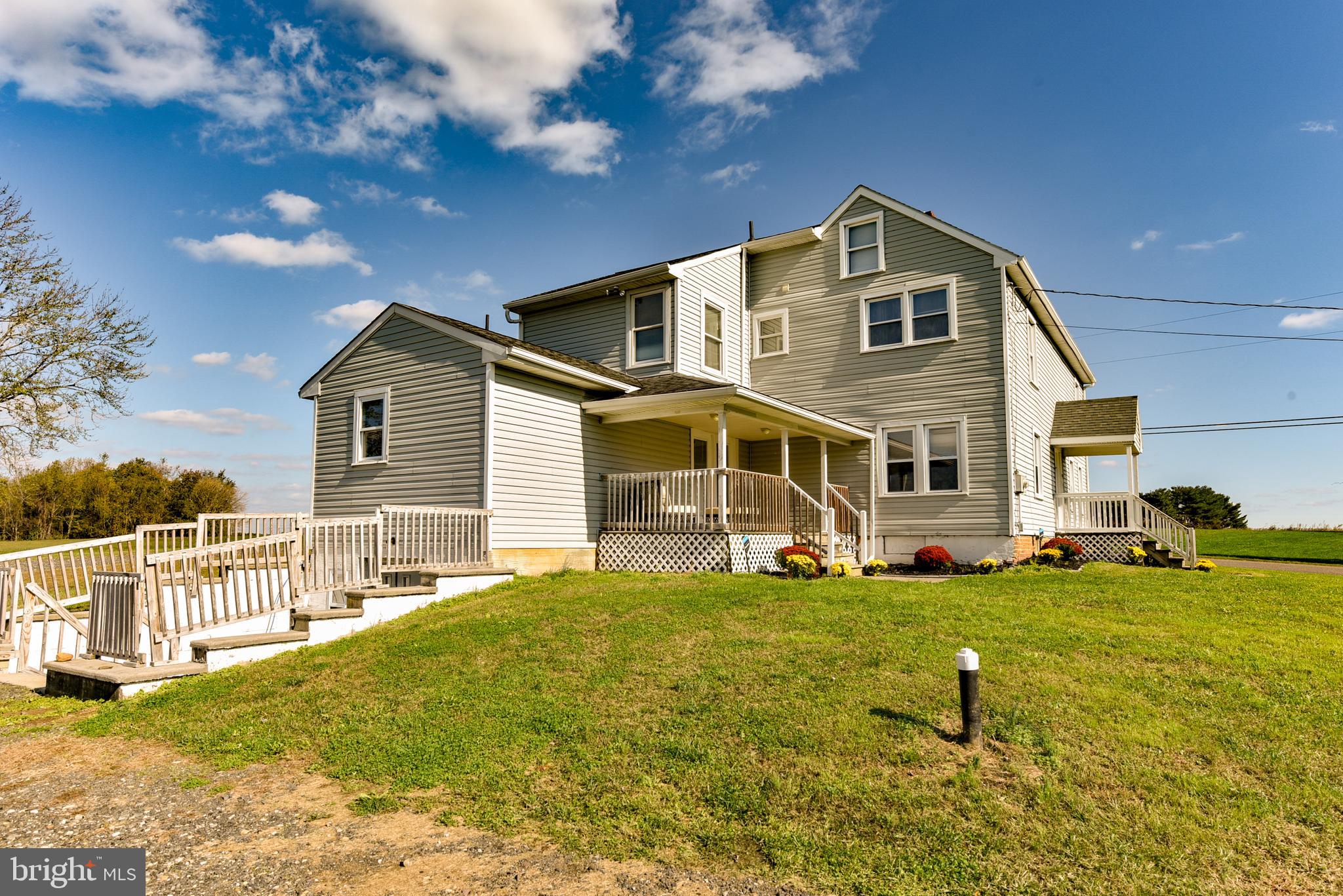 19 Harrisonville Lake Road Pilesgrove, NJ 08098 - Photo 32 of 44 a front view of a house with a yard