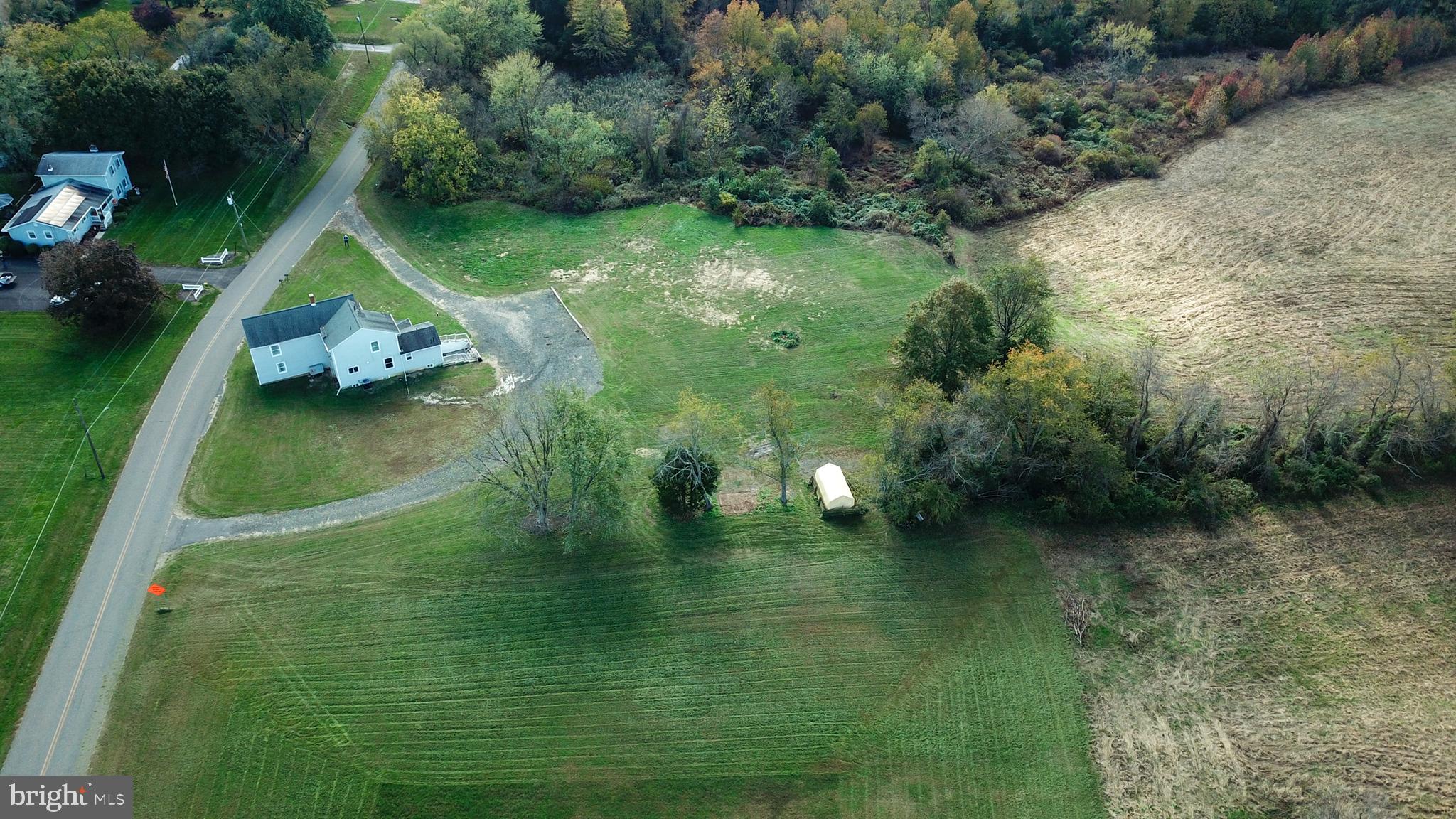 19 Harrisonville Lake Road Pilesgrove, NJ 08098 - Photo 35 of 44 a view of a lake with a yard