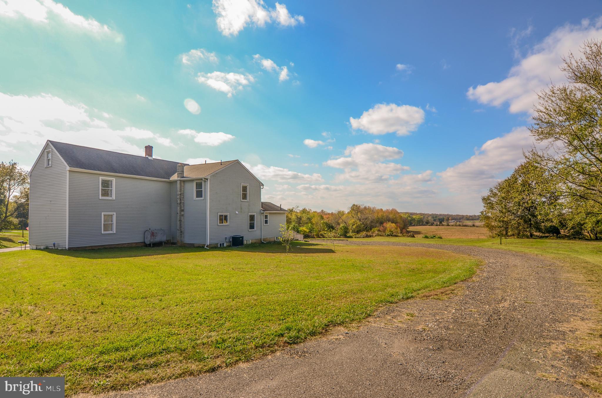 19 Harrisonville Lake Road Pilesgrove, NJ 08098 - Photo 42 of 44 a view of a large pool with an outdoor space and seating area