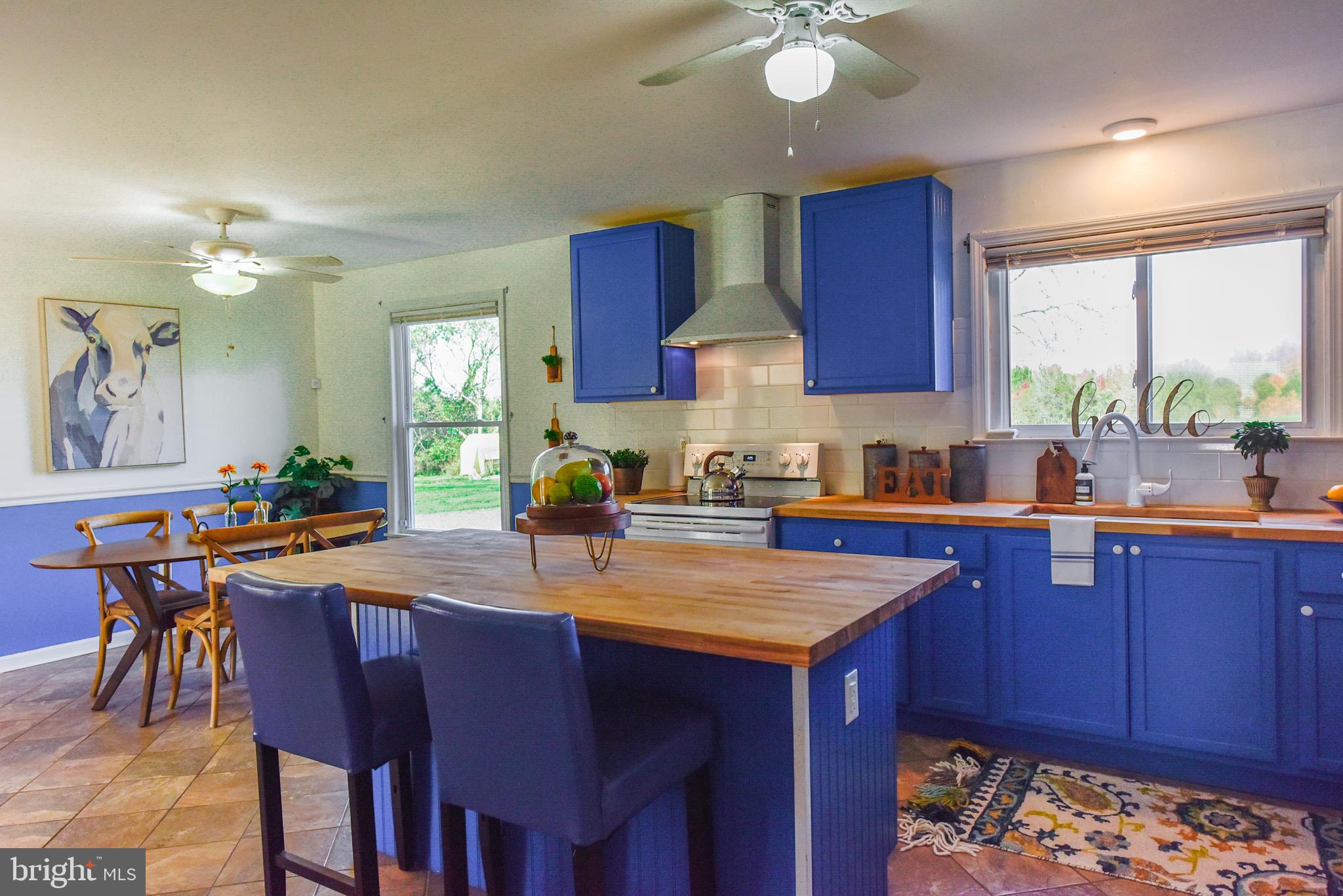 19 Harrisonville Lake Road Pilesgrove, NJ 08098 - Photo 7 of 44 a kitchen with a stove a sink and a refrigerator