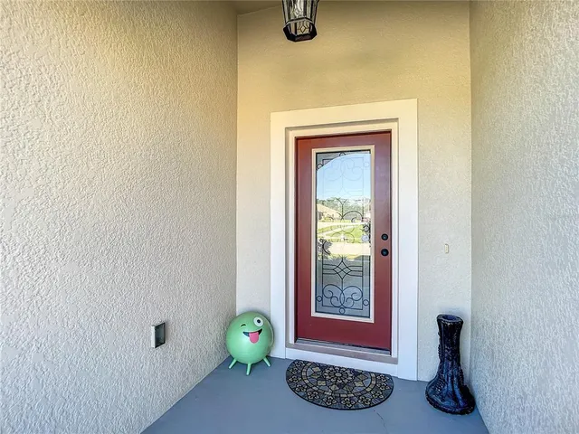 a view of a livingroom with wooden floor and a window