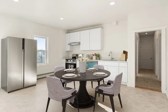 a dining room with furniture and window