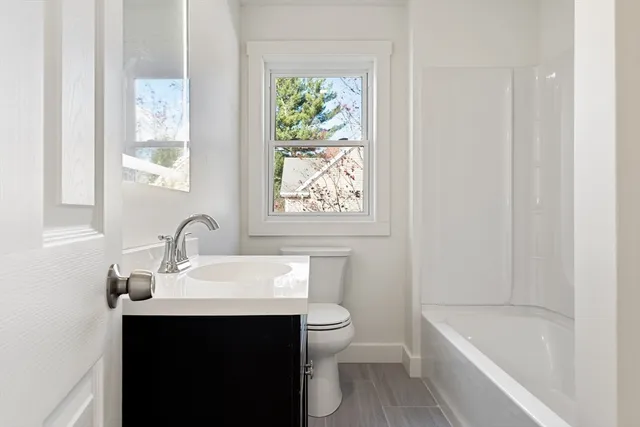 a bathroom with a sink a toilet and a bathtub
