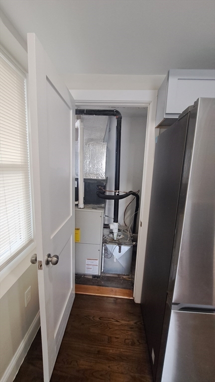 7 Samoset Street, Unit 2 Boston, MA 02124 - Photo 9 of 12 a hallway with wooden floor and staircase