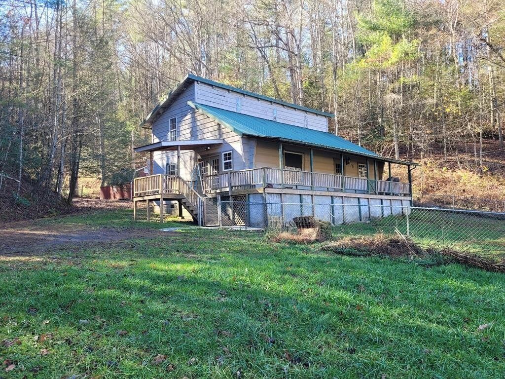 145 Crawford Stiles Road Farner, TN 37333 - Photo 1 of 45 a front view of a house with garden