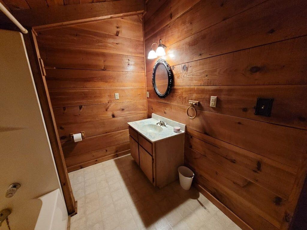 145 Crawford Stiles Road Farner, TN 37333 - Photo 15 of 45 a bathroom with a sink a vanity and mirror