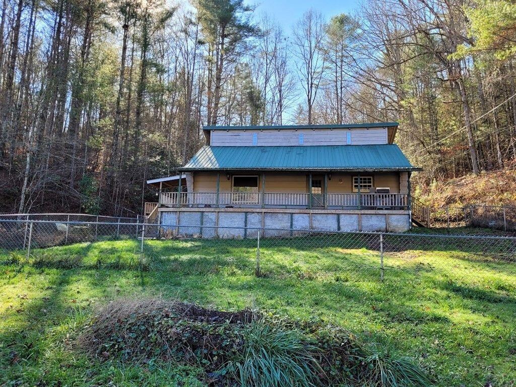 145 Crawford Stiles Road Farner, TN 37333 - Photo 18 of 45 a backyard of a house with lots of green space and wooden fence
